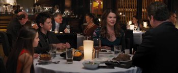 Movie still from “Middle School: The Worst Years of My Life” (2016), directed by Steve Carr – A group of people sitting at a table with food; Medium shot, Over the shoulder angle