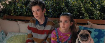 Movie still from “Middle School: The Worst Years of My Life” (2016), directed by Steve Carr – A boy and a little girl sitting on a bench; Close Up shot, High angle
