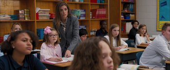 Movie still from “Middle School: The Worst Years of My Life” (2016), directed by Steve Carr – A woman standing in front of a group of children; Medium shot, Over the shoulder angle