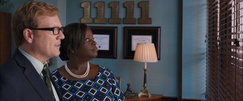 Movie still from “Middle School: The Worst Years of My Life” (2016), directed by Steve Carr – A woman sitting in front of a lamp in a room; Medium shot, Over the shoulder angle
