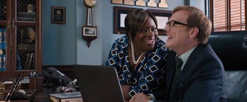 Movie still from “Middle School: The Worst Years of My Life” (2016), directed by Steve Carr – Two people sitting in front of a computer smiling; Medium shot, Over the shoulder angle