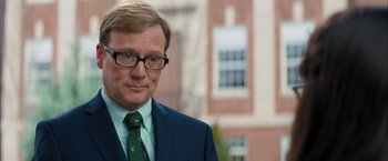 Movie still from “Middle School: The Worst Years of My Life” (2016), directed by Steve Carr – A person wearing a suit and tie; Close Up shot, Over the shoulder angle