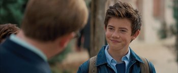 Movie still from “Middle School: The Worst Years of My Life” (2016), directed by Steve Carr – A young boy smiling at another young man; Close Up shot, Over the shoulder angle