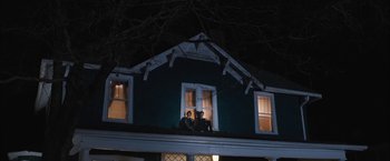 Movie still from “Middle School: The Worst Years of My Life” (2016), directed by Steve Carr – Two people sitting on the roof of a house at night; Wide shot, Low angle