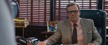 Movie still from “Middle School: The Worst Years of My Life” (2016), directed by Steve Carr – A man sitting at a desk in front of a computer; Medium shot, Over the shoulder angle