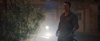 Movie still from “Middle School: The Worst Years of My Life” (2016), directed by Steve Carr – A man walking down a street at night; Medium shot, Low angle