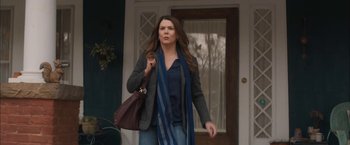 Movie still from “Middle School: The Worst Years of My Life” (2016), directed by Steve Carr – A woman walking down the street holding a purse; Medium shot, Over the shoulder angle