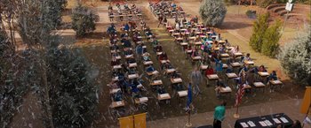 Movie still from “Middle School: The Worst Years of My Life” (2016), directed by Steve Carr – An aerial view of a group of people sitting at desks; Extreme Wide shot, High angle
