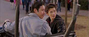 Movie still from “Middle School: The Worst Years of My Life” (2016), directed by Steve Carr – A man sitting next to another man on a bench; Close Up shot, Over the shoulder angle