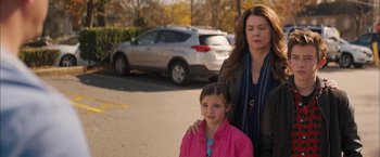 Movie still from “Middle School: The Worst Years of My Life” (2016), directed by Steve Carr – A woman and a young girl standing in a parking lot; Medium shot, Over the shoulder angle