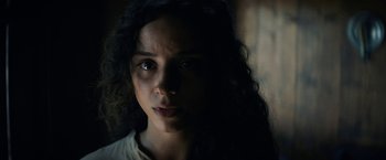 Movie still from “Fear Street: Part Three - 1666” (2021), directed by Leigh Janiak – A person with long hair; Close Up shot, Low angle