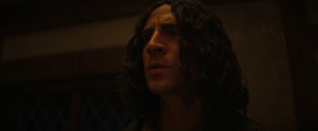 Movie still from “Fear Street: Part Three - 1666” (2021), directed by Leigh Janiak – A person with long curly hair; Close Up shot, Low angle
