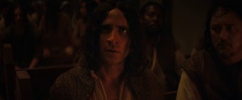 Movie still from “Fear Street: Part Three - 1666” (2021), directed by Leigh Janiak – A person with long black hair; Close Up shot, Over the shoulder angle