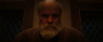 Movie still from “Fear Street: Part Three - 1666” (2021), directed by Leigh Janiak – An old man with a long white beard; Close Up shot, Low angle