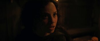 Movie still from “Fear Street: Part Three - 1666” (2021), directed by Leigh Janiak – A woman's face in the dark; Close Up shot, Low angle