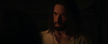 Movie still from “Fear Street: Part Three - 1666” (2021), directed by Leigh Janiak – A person with long black hair; Close Up shot, Over the shoulder angle