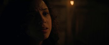 Movie still from “Fear Street: Part Three - 1666” (2021), directed by Leigh Janiak – A person with curly hair; Close Up shot, Low angle
