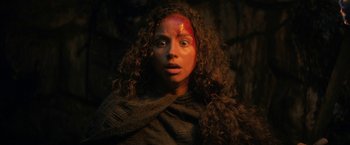 Movie still from “Fear Street: Part Three - 1666” (2021), directed by Leigh Janiak – A young woman with a red head and a red forehead; Close Up shot, Low angle