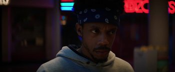 Movie still from “Fear Street: Part Three - 1666” (2021), directed by Leigh Janiak – A person wearing a hat; Close Up shot, Low angle