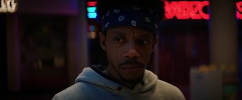 Movie still from “Fear Street: Part Three - 1666” (2021), directed by Leigh Janiak – A person wearing a hat; Close Up shot, Low angle