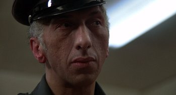 Movie still from “Midnight Express” (1978), directed by Alan Parker – A person wearing a hat; Close Up shot, Low angle