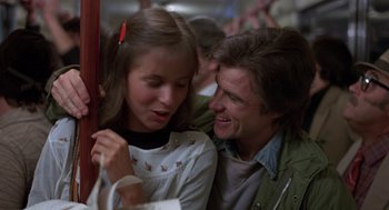 Movie still from “Midnight Express” (1978), directed by Alan Parker – A man and a woman sitting next to each other on a train; Close Up shot, Low angle