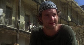Movie still from “Midnight Express” (1978), directed by Alan Parker – A person wearing a hat; Close Up shot, Low angle