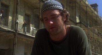 Movie still from “Midnight Express” (1978), directed by Alan Parker – A person wearing a hat; Close Up shot, Low angle