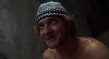 Movie still from “Midnight Express” (1978), directed by Alan Parker – A person wearing a hat; Close Up shot, Low angle