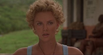 Movie still from “Mighty Joe Young” (1998), directed by Ron Underwood – Charlize theron in the movie young adult; Close Up shot, Over the shoulder angle