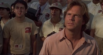 Movie still from “Mighty Joe Young” (1998), directed by Ron Underwood – A group of people standing in front of each other; Close Up shot, Low angle