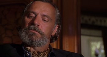 Movie still from “Mighty Joe Young” (1998), directed by Ron Underwood – A person with a beard; Close Up shot, Low angle