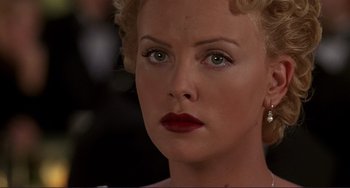 Movie still from “Mighty Joe Young” (1998), directed by Ron Underwood – A woman's face with red lipstick; Close Up shot, Over the shoulder angle