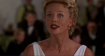 Movie still from “Mighty Joe Young” (1998), directed by Ron Underwood – A person wearing a white dress; Close Up shot, Over the shoulder angle