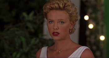Movie still from “Mighty Joe Young” (1998), directed by Ron Underwood – A person with short hair; Close Up shot, Over the shoulder angle