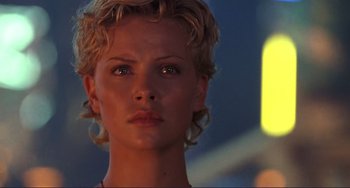 Movie still from “Mighty Joe Young” (1998), directed by Ron Underwood – A person with short hair; Close Up shot, Low angle