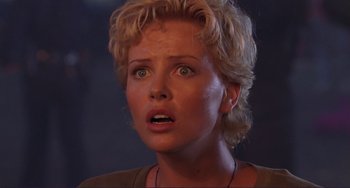Movie still from “Mighty Joe Young” (1998), directed by Ron Underwood – A person with short blonde hair; Close Up shot, Low angle