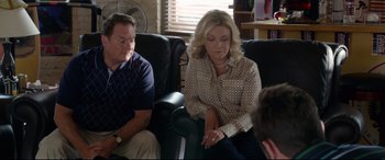 Movie still from “Mike and Dave Need Wedding Dates” (2016), directed by Jake Szymanski – A woman sitting on a couch next to two men; Medium shot, Over the shoulder angle