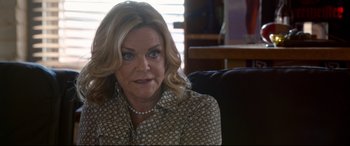 Movie still from “Mike and Dave Need Wedding Dates” (2016), directed by Jake Szymanski – A person sitting on a chair; Close Up shot, Over the shoulder angle