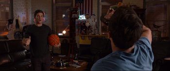 Movie still from “Mike and Dave Need Wedding Dates” (2016), directed by Jake Szymanski – Two people sitting at a table in front of a window; Medium shot, Over the shoulder angle