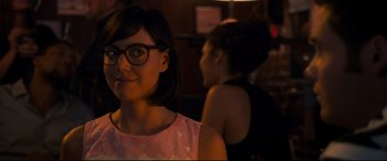 Movie still from “Mike and Dave Need Wedding Dates” (2016), directed by Jake Szymanski – A woman wearing glasses is looking at the camera; Close Up shot, Over the shoulder angle