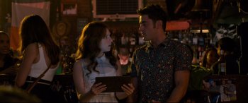 Movie still from “Mike and Dave Need Wedding Dates” (2016), directed by Jake Szymanski – A man and a woman looking at each other in front of a bar; Medium shot, Over the shoulder angle