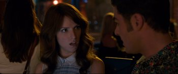 Movie still from “Mike and Dave Need Wedding Dates” (2016), directed by Jake Szymanski – A young woman sitting next to a man in a restaurant; Close Up shot, Over the shoulder angle