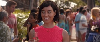 Movie still from “Mike and Dave Need Wedding Dates” (2016), directed by Jake Szymanski – A woman holding a wine glass in her right hand; Close Up shot, Over the shoulder angle