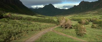 Movie still from “Mike and Dave Need Wedding Dates” (2016), directed by Jake Szymanski – A dirt road going through a lush green field; Extreme Wide shot, High angle
