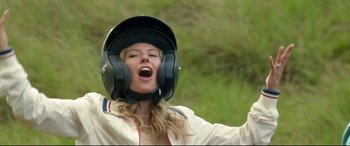 Movie still from “Mike and Dave Need Wedding Dates” (2016), directed by Jake Szymanski – A woman with a helmet on her head; Medium shot, Low angle