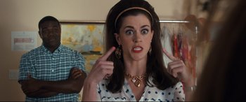 Movie still from “Mike and Dave Need Wedding Dates” (2016), directed by Jake Szymanski – A woman with her fingers in her mouth; Close Up shot, Over the shoulder angle