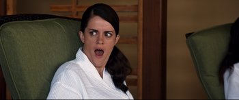 Movie still from “Mike and Dave Need Wedding Dates” (2016), directed by Jake Szymanski – A woman in a white robe is making a funny face; Close Up shot, Low angle