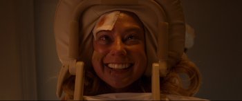 Movie still from “Mike and Dave Need Wedding Dates” (2016), directed by Jake Szymanski – A woman with bandages on her head and face; Close Up shot, Overhead angle