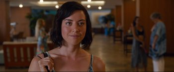 Movie still from “Mike and Dave Need Wedding Dates” (2016), directed by Jake Szymanski – A beautiful young lady standing in a room; Close Up shot, Over the shoulder angle